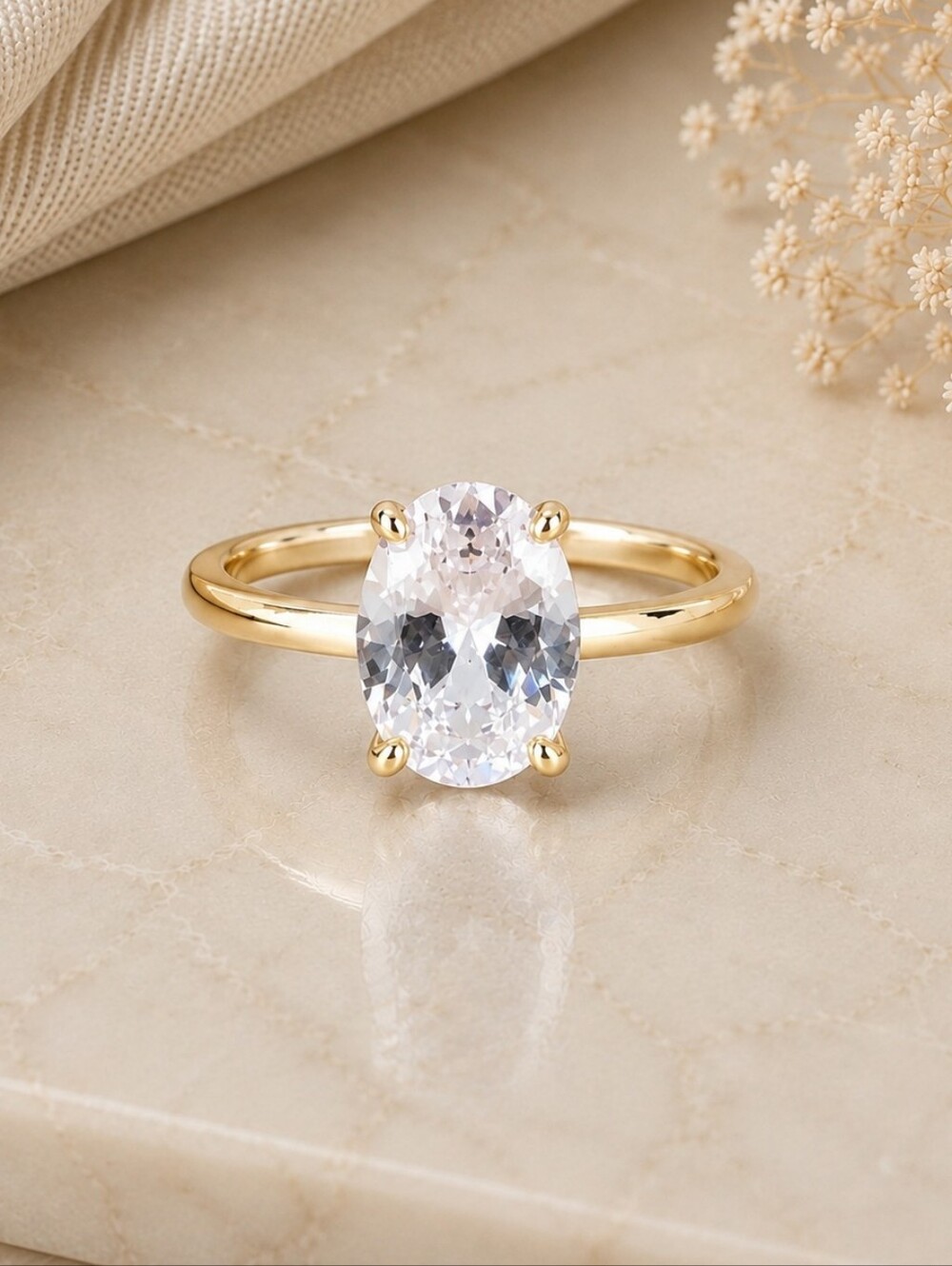 Classic Gold Oval Solitaire Ring with Clear Gemstone